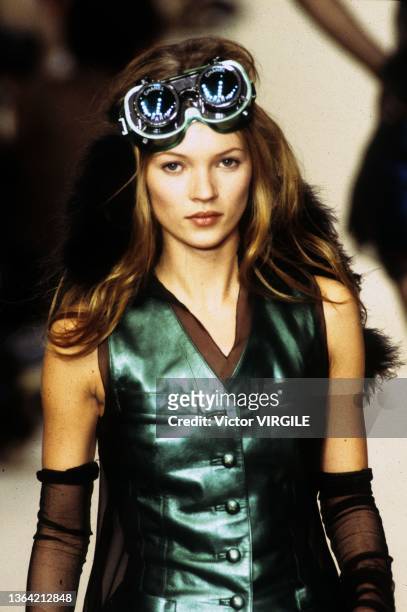 Model Kate Moss walks the runway during the Chanel Ready to Wear Fall Winter show as part of the Paris Fashion Week on March 03, 1994.