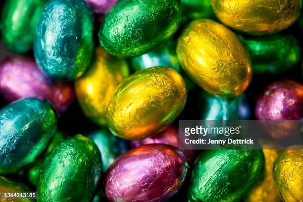 easter eggs - chocolate foil stock-fotos und bilder