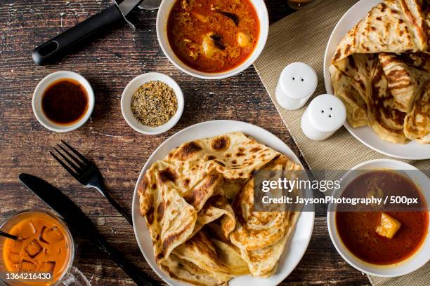 malaysian cuisine roti canai,directly above shot of food on table,new york,united states,usa - roti canai stock pictures, royalty-free photos & images