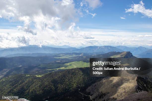 mountain landscape,scenic view of mountains against sky - iulian andrei stock-fotos und bilder