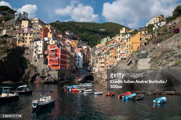 panoramic view of sea and buildings against sky,case sparse ridarolo,italy - iulian andrei stock-fotos und bilder