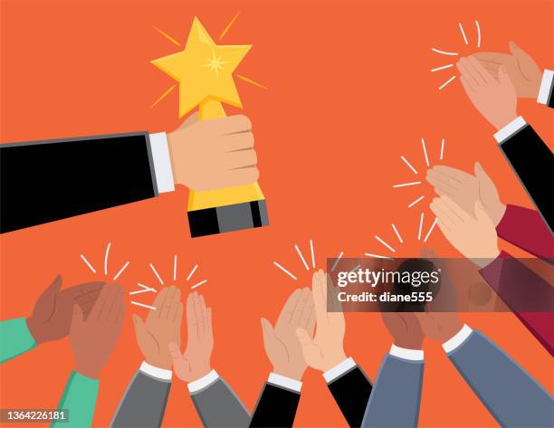 hand holding a winning trophy while people clap and cheer - actor vector stock illustrations