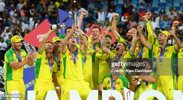 Mitchell Marsh of Australia lifts the World Cup Trophy with teammates after the ICC Men's T20 World Cup final match between New Zealand and Australia...