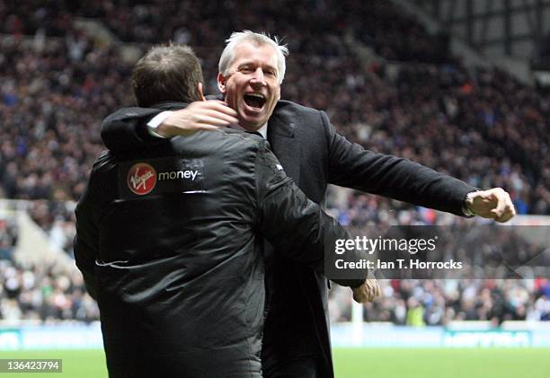 Newcastle manager Alan Pardew celebrates the third goal withJohn Carver during the Barclays Premier League match between Newcastle United and...