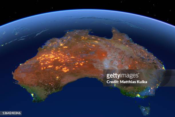 australia, night lights on earth with topographical relief - australiadigital image stock pictures, royalty-free photos & images