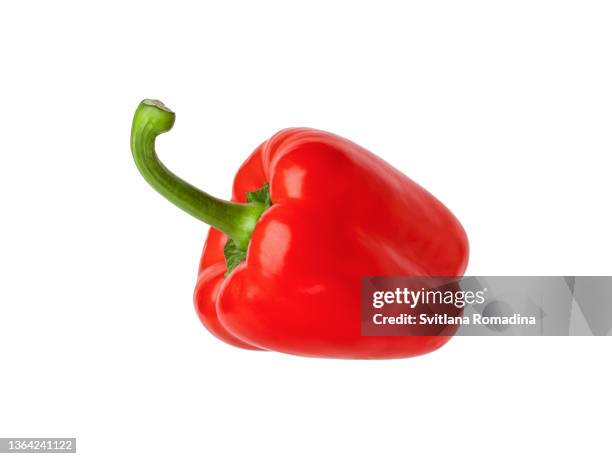 close-up photo of red sweet pepper against white background - paprika stock-fotos und bilder