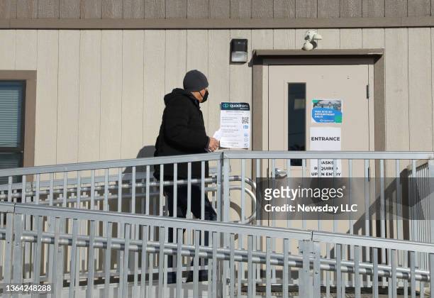 Man arrives for his COVID-19 test on the first day of operation for the new mobile testing center set up on the Stony Brook University research...