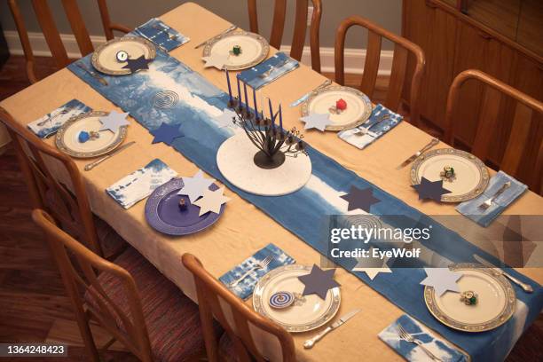 overhead shot of a formal dinner table set up for a family chanukah celebration. - formal party stock pictures, royalty-free photos & images