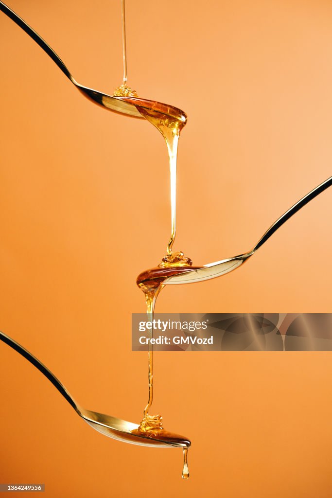 Pouring Honey into a Jar