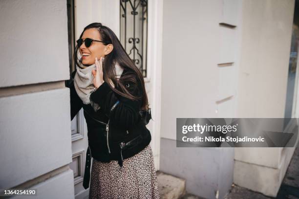 a woman talking on the intercom - audio intercom system stock pictures, royalty-free photos & images