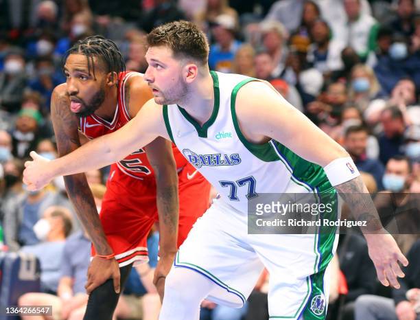 Luka Doncic of the Dallas Mavericks guards Derrick Jones Jr. #5 of the Chicago Bulls at American Airlines Center on January 09, 2022 in Dallas,...