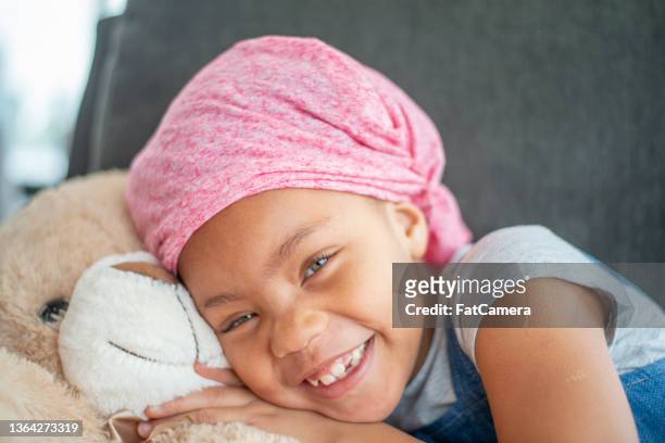 cancer patient and her teddy bear - childhood cancer stock pictures, royalty-free photos & images
