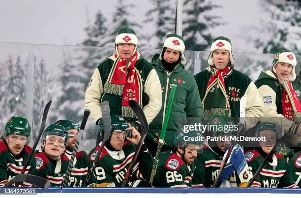 Head coach Dean Evason of the Minnesota Wild and staff stands on the bench during the 2022 NHL Winter Classic between the St. Louis Blues and the...