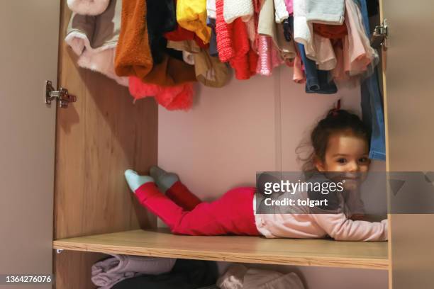 little girl in the wardrobe - childrens closet stock pictures, royalty-free photos & images