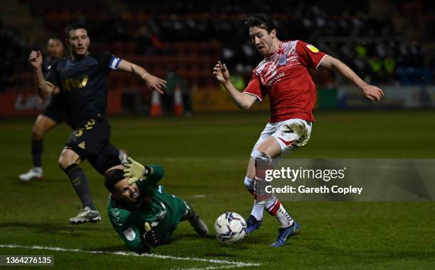 Charlton goalkeeper Stephen Henderson saves the ball from the feet of Chris Long of Crewe during the Sky Bet League One match between Crewe Alexandra...