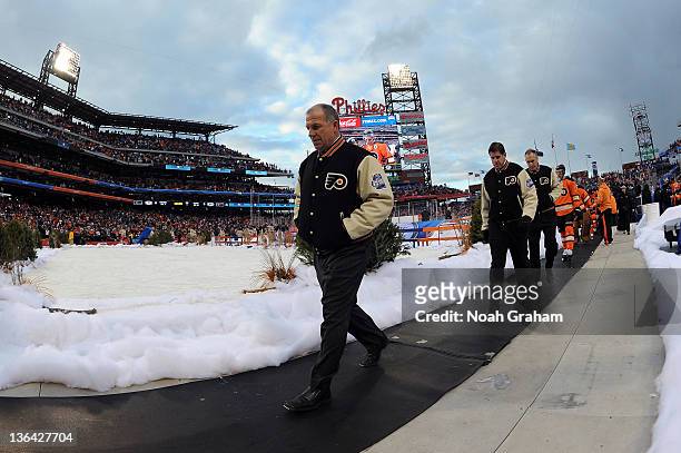 The Philadelphia Flyers walk to the locker rooms against the New York Rangers during the 2012 Bridgestone NHL Winter Classic at Citizens Bank Park on...