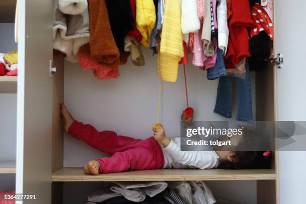 little girl in the wardrobe - childrens closet stock pictures, royalty-free photos & images