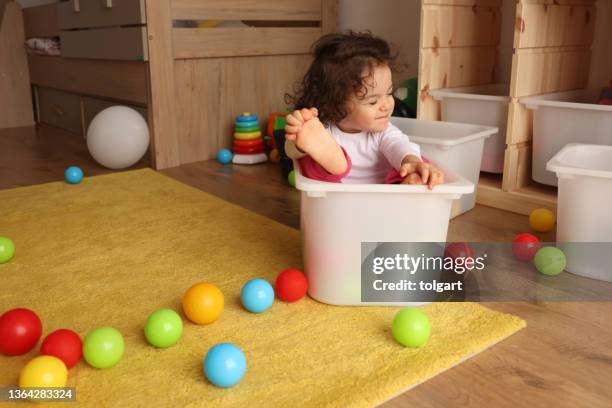 a little girl playing toys - lekrum bildbanksfoton och bilder