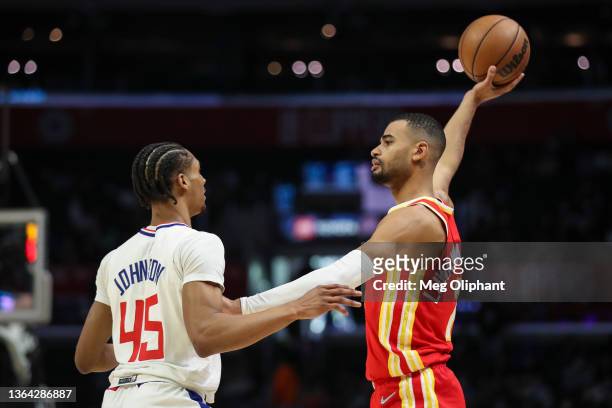 Timothe Luwawu-Cabarrot of the Atlanta Hawks looks to pass the ball defended by Keon Johnson of the LA Clippers at Crypto.com Arena on January 09,...