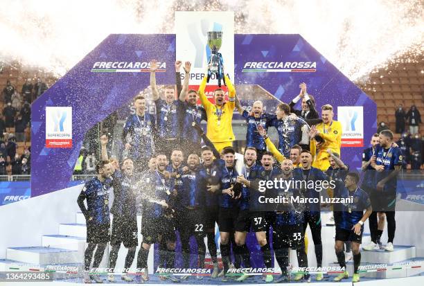 Samir Handanovic of Inter Milan lifts the Italian Supercup trophy following victory in the Italian Supercup match between Inter and Juventus at The...