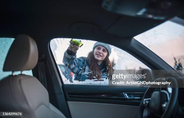 scraping ice from car windows - car window stock pictures, royalty-free photos & images