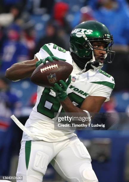 Jamison Crowder of the New York Jets makes a catch during warmups before a game against the Buffalo Bills at Highmark Stadium on January 9, 2022 in...