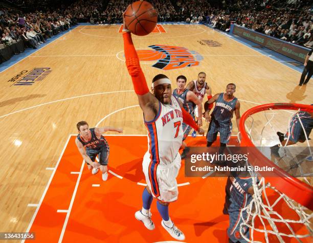 Carmelo Anthony of the New York Knicks goes in for a slam dunk against the Charlotte Bobcats on January 4, 2012 at Madison Square Garden in New York...