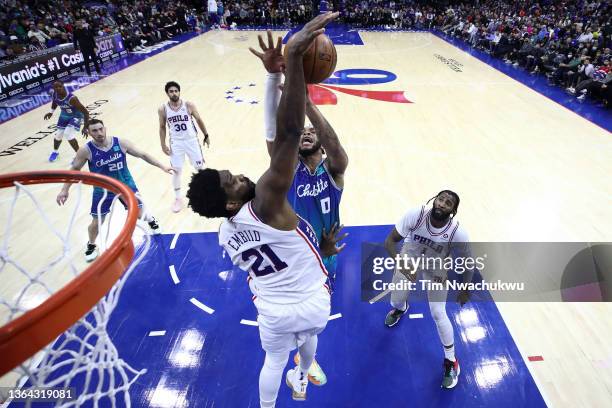 Joel Embiid of the Philadelphia 76ers blocks Miles Bridges of the Charlotte Hornets during the fourth quarter at Wells Fargo Center on January 12,...