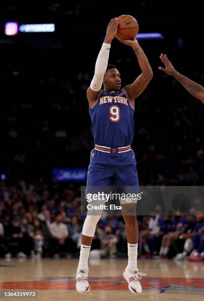 Barrett of the New York Knicks takes a three point shot in the second half against the Dallas Mavericks at Madison Square Garden on January 12, 2022...