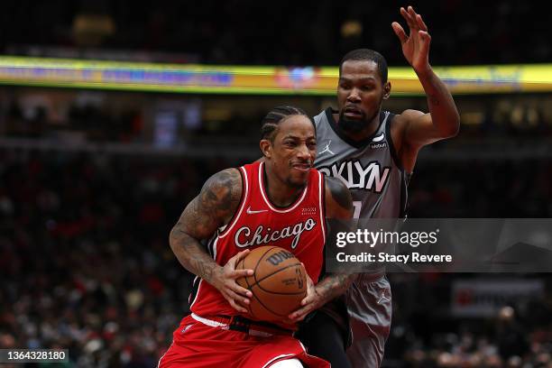 DeMar DeRozan of the Chicago Bulls drives to the basket against Kevin Durant of the Brooklyn Nets during the first half of a game at United Center on...