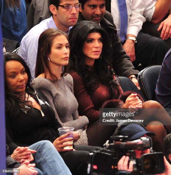 Dayana Mendoza and Theresa Guidice attend the Charlotte Bobcats vs the New York Knicks game at Madison Square Garden on January 4, 2012 in New York...