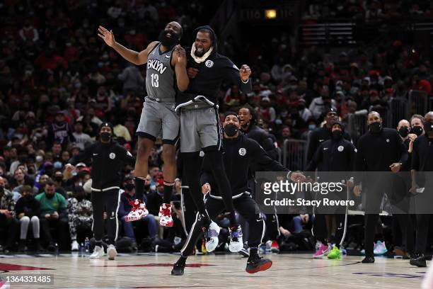 James Harden and Kevin Durant of the Brooklyn Nets celebrate after a score during the second half of a game against the Chicago Bulls at United...