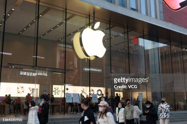 People walk past an Apple store on January 12, 2022 in Shanghai, China.