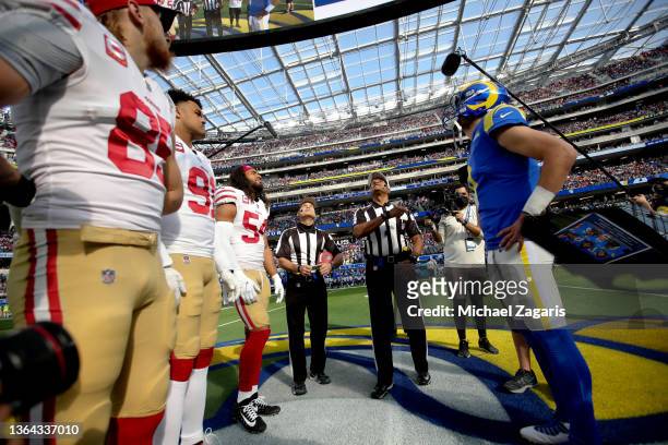 Captains of the San Francisco 49ers and the Los Angeles Rams during the coin toss before the game at SoFi Stadium on January 9, 2022 in Inglewood,...