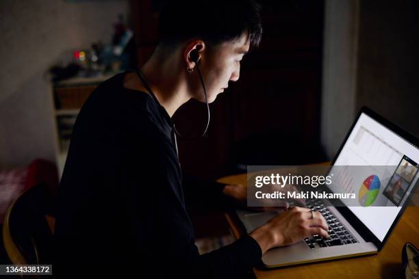 gen z men having a remote meeting in the living room of the house. - z com stock pictures, royalty-free photos & images