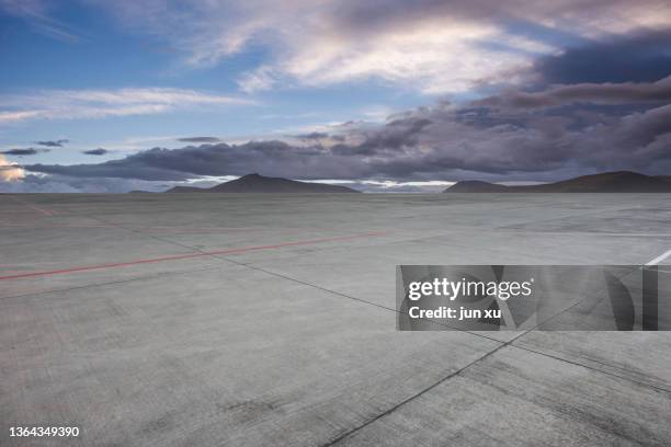a spacious and bright airstrip - tarmac stock pictures, royalty-free photos & images