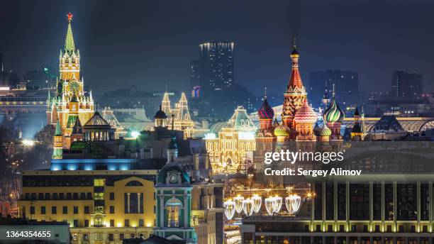 st basil's cathedral and towers of the moscow kremlin at night - religion politics stock pictures, royalty-free photos & images