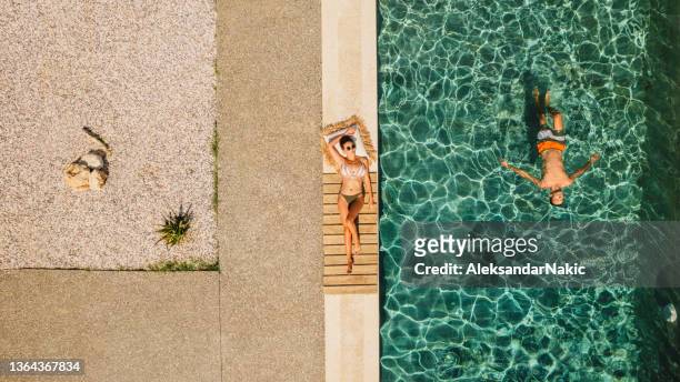 pool days - man escaping stock pictures, royalty-free photos & images