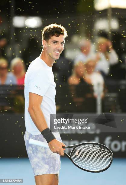 Thanasi Kokkinakis of Australia amongst ball dust from his last shot in his match against Aleksandar Vukic of Australia during day five of the 2022...