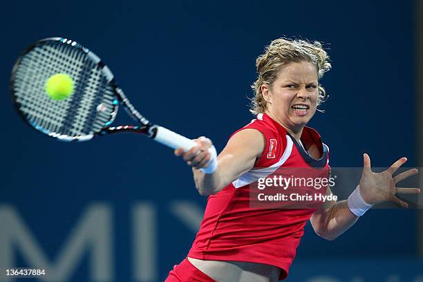 Kim Clijsters of Belguim plays a forehand against Iveta Benesova of the Czech Republic during day five of the 2012 Brisbane International at Pat...