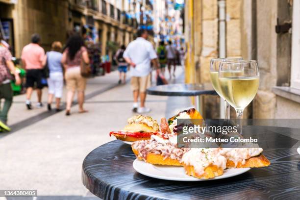 typical pintxos (tapas) of san sebastian, basque country, spain - tapas stock pictures, royalty-free photos & images