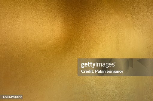 Gold color with old grunge wall concrete texture as background. Gold color with old grunge wall concrete texture as background.