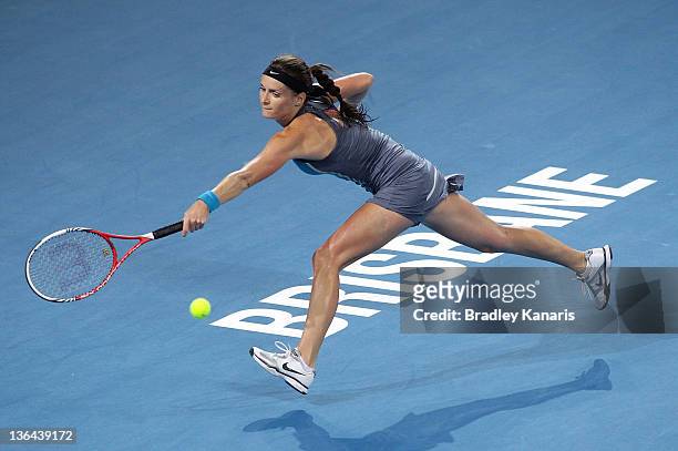 Iveta Benesova of the Czech Republic plays a backhand in her quarter final match against Kim Clijsters of Belguim during day five of the 2012...