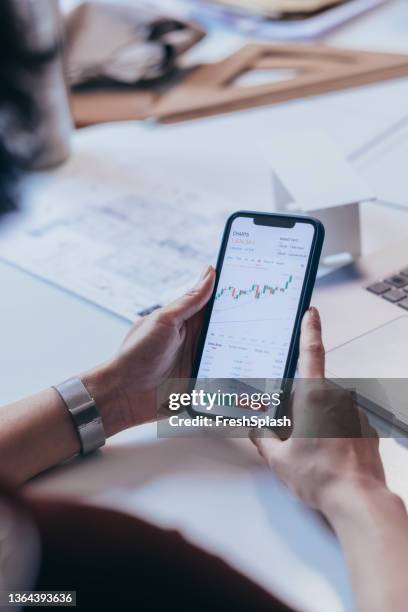 an anonymous female doing some research on her smartphone using some application - exchange trade show stock pictures, royalty-free photos & images