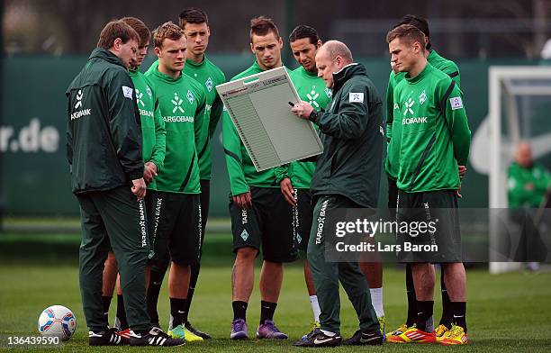 Head coach Thomas Schaaf gives instructions to his players during a training session at day two of Werder Bremen training camp on January 5, 2012 in...