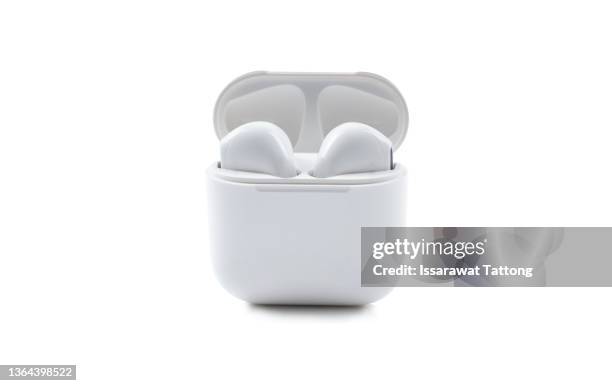 white electronic bluetooth earphones and case technical isolated on white background - auriculares inalámbricos internos fotografías e imágenes de stock