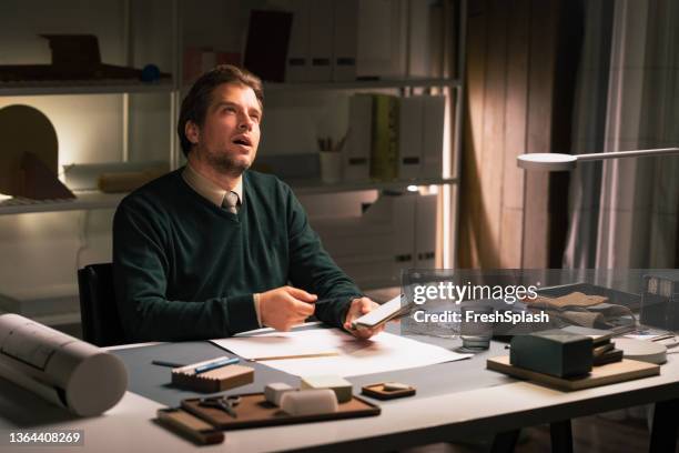 a smart handsome engineer sitting in his office and working hard - work hard play hard stock pictures, royalty-free photos & images