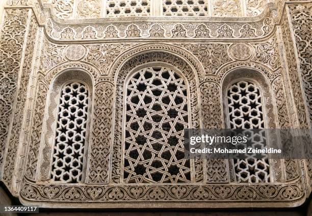 intricate arched patterned windows in the qalawun complex in cairo - islamic window stock pictures, royalty-free photos & images