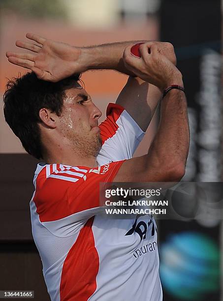 England's cricketer Steven Finn delivers a ball during a practice session at the ICC Global Cricket Academy in Dubai Sports City on January 5, 2012....