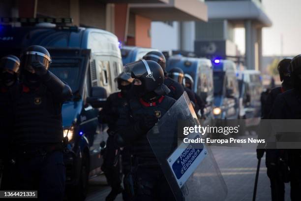 Police officers during the eviction of a squatted industrial building that is in disuse in Progres street in Badalona, on 13 January, 2022 in...